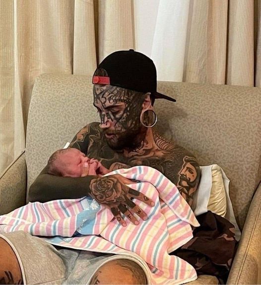 A 24-year-old father, who has several tattoos all over his body, makes the decision to get them erased for his child