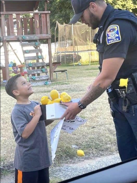 Police officer surprises 7-year-old boy selling lemonade with a pair of brand new sneakers for school