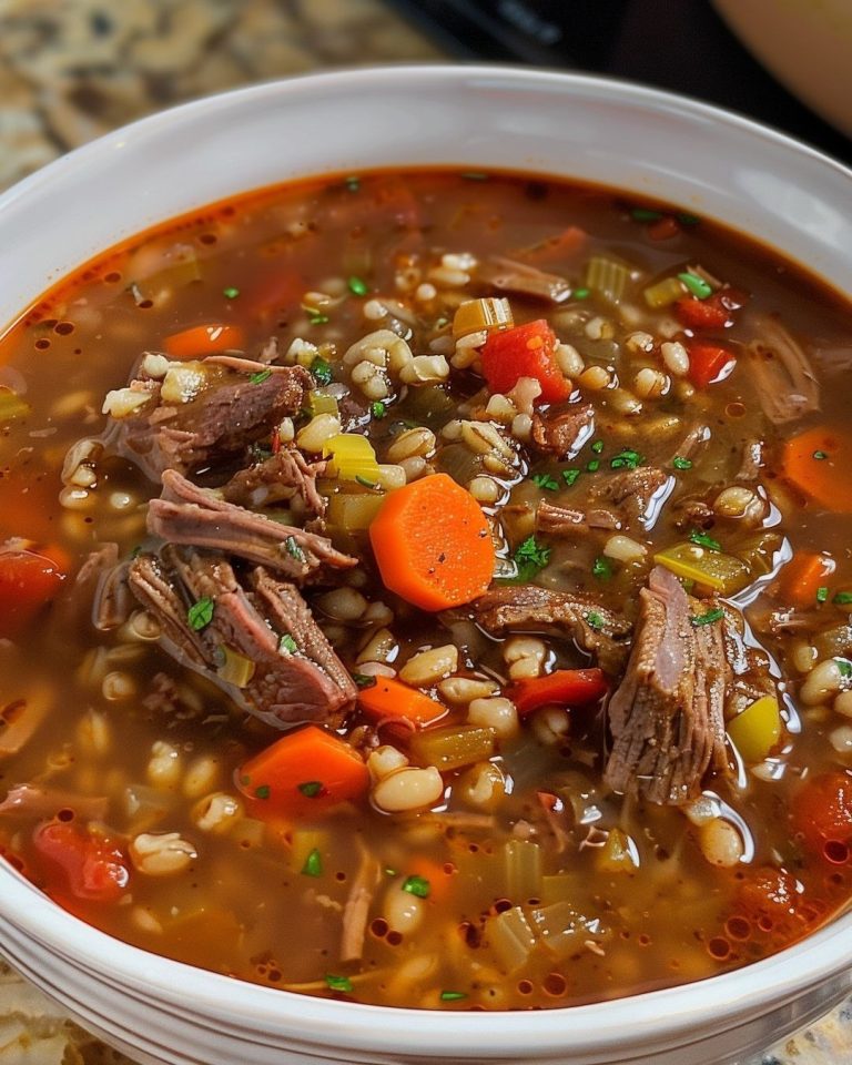 Beef Barley Soup is a delectable combination of beef, carrots, celery, onions, tomatoes, corn, and barley in a deliciously seasoned beef broth. This delicious soup can be made quickly with stew meat or simmered low and slow with a chuck roast.