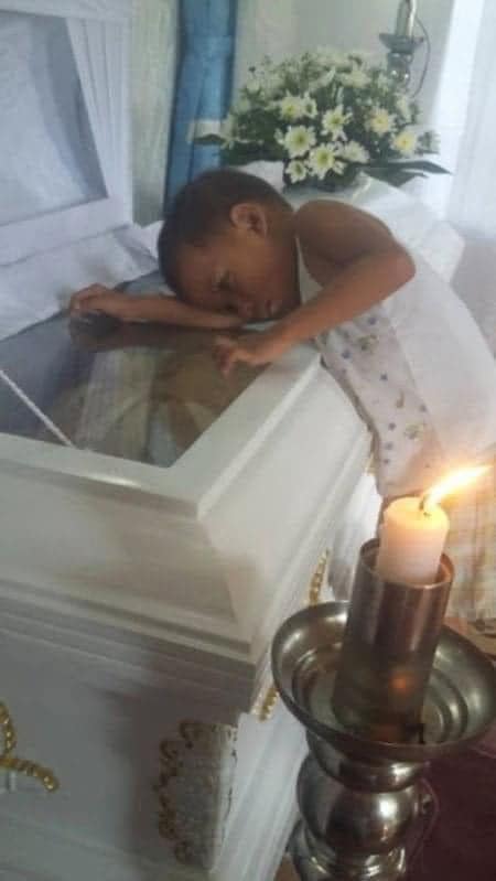 Boy hugs mom’s coffin after she dies birthing his brother