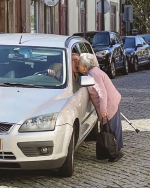 SHE USED TO KISS HIM THROUGH THE CAR WINDOW, NOW SHE WALKS TO THE MARKET BY HERSELF